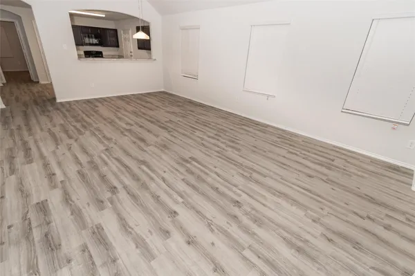 a view of a livingroom with wooden floor