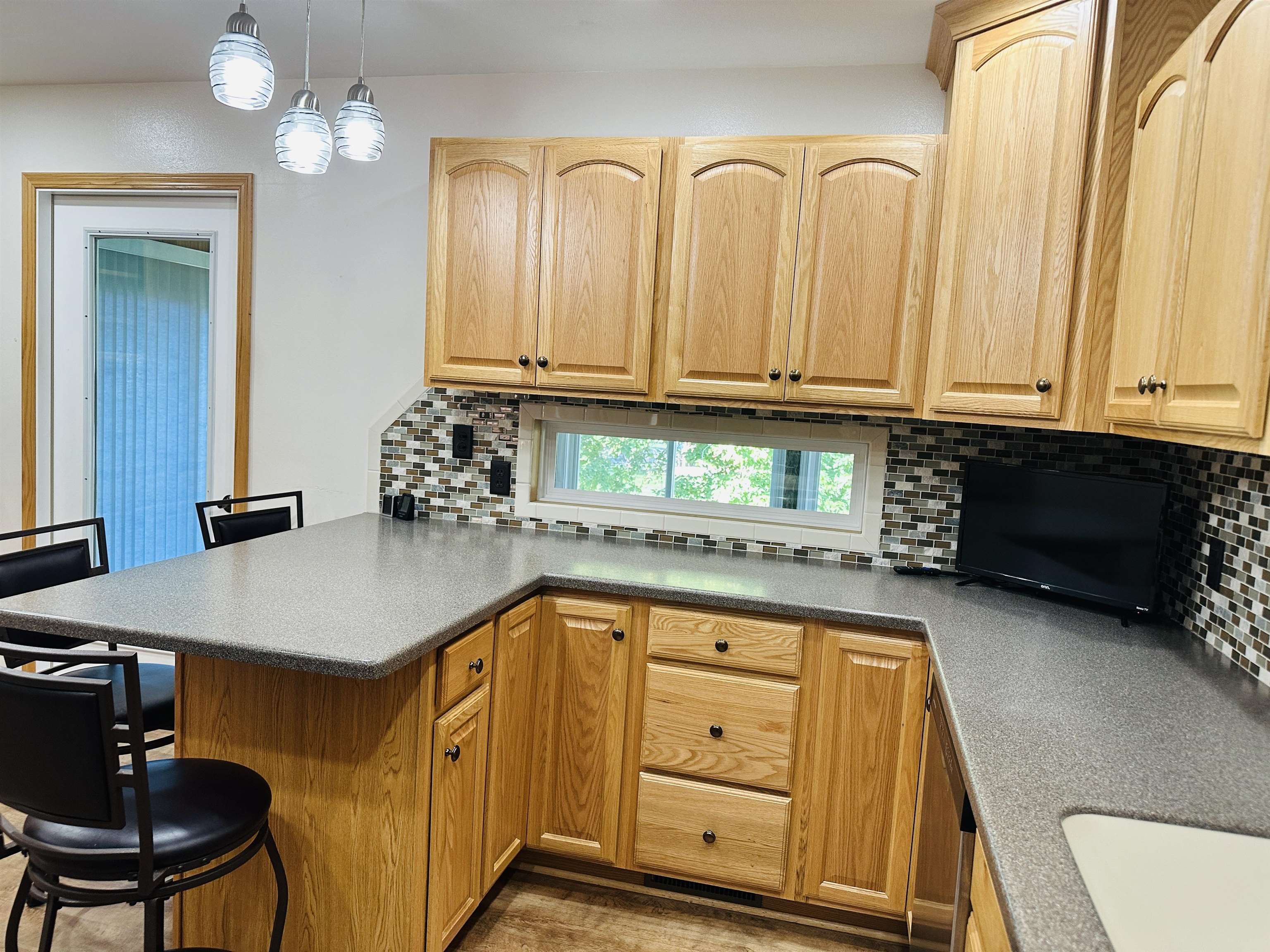 219 Palm Drive Lena, IL 61048 - Photo 16 of 49 a kitchen with stainless steel appliances granite countertop a sink a stove and cabinets