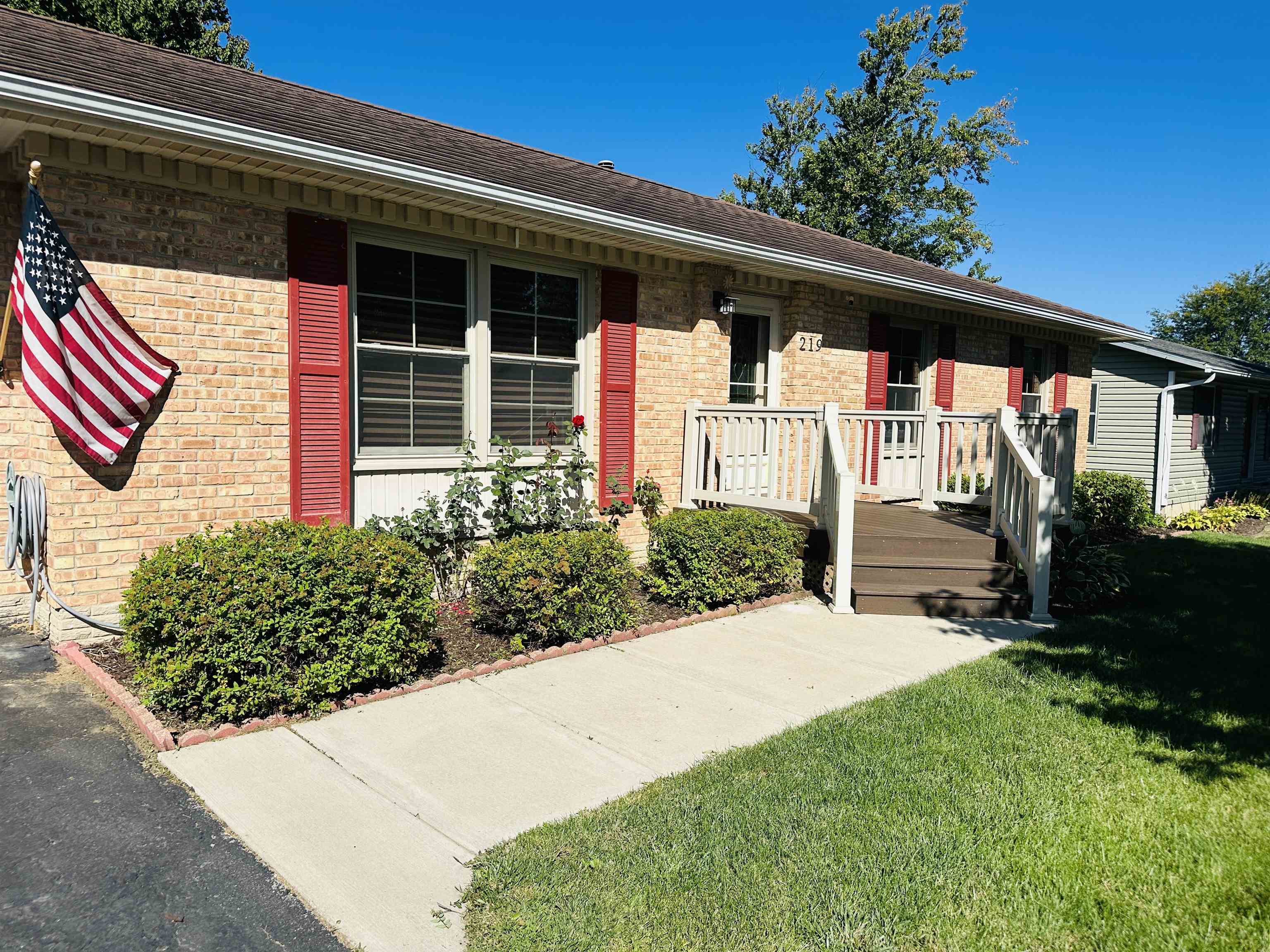 219 Palm Drive Lena, IL 61048 - Photo 2 of 49 a front view of a house with a yard