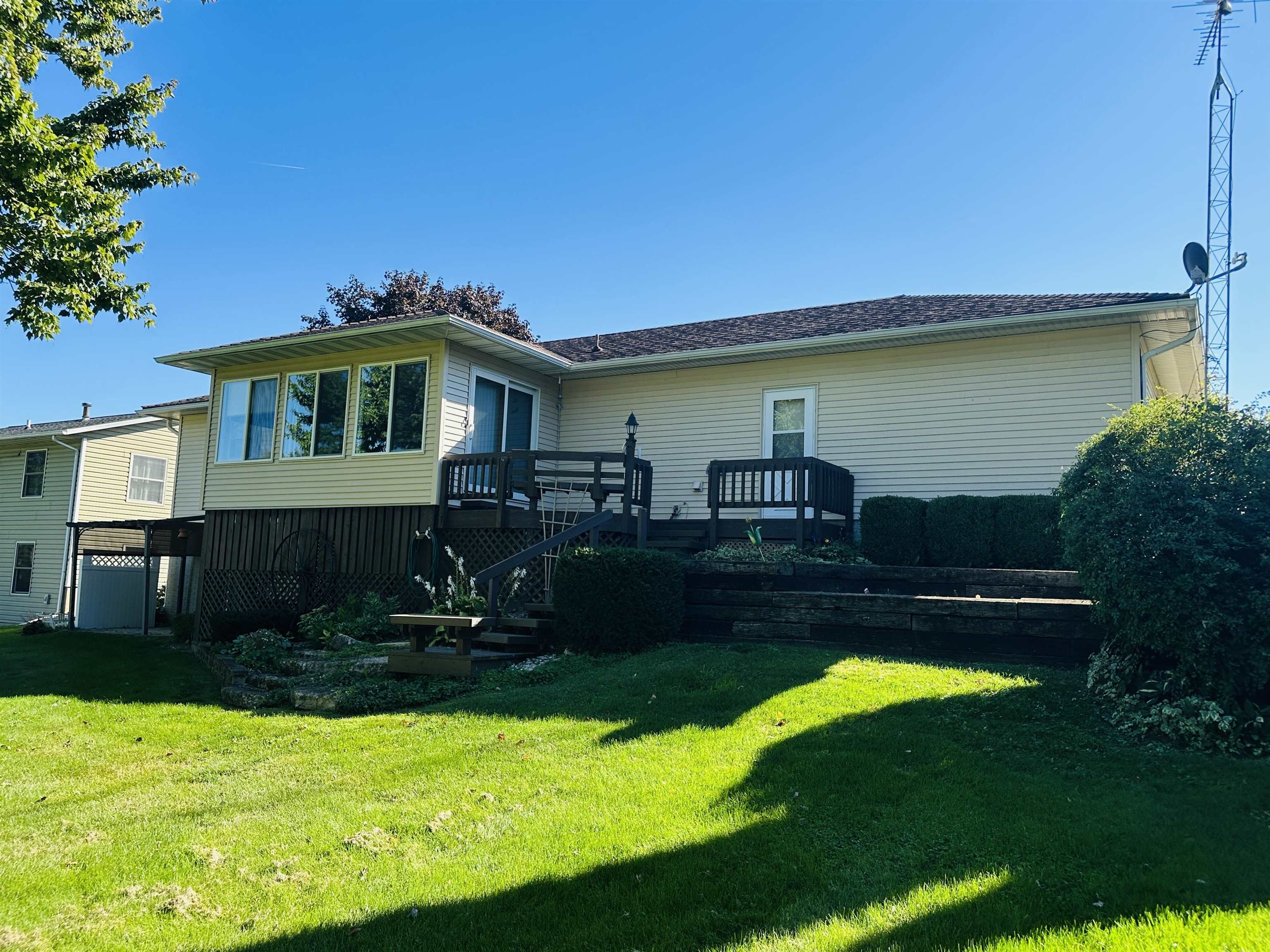 219 Palm Drive Lena, IL 61048 - Photo 46 of 49 a front view of a house with garden