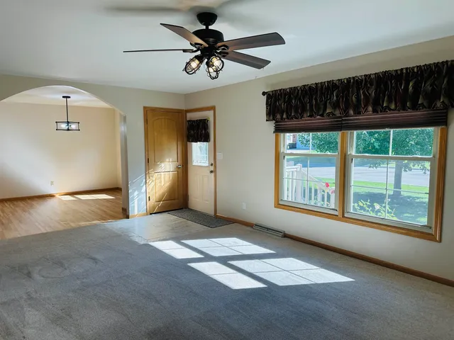 a view of an empty room with a window