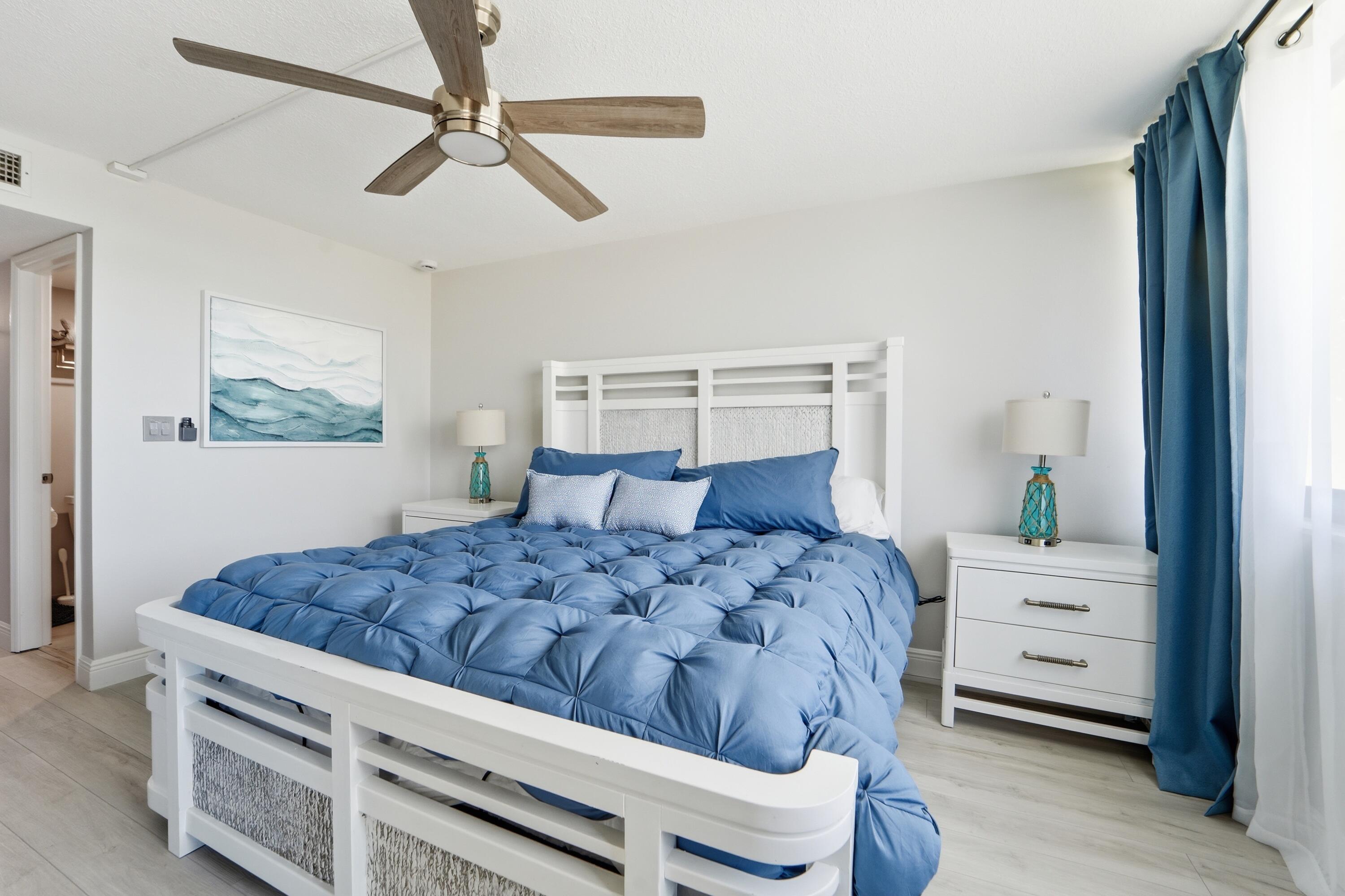 1605 Highway 1, Unit 303M1 Jupiter, FL 33477 - Photo 14 of 42 a bedroom with a bed and a cabinets