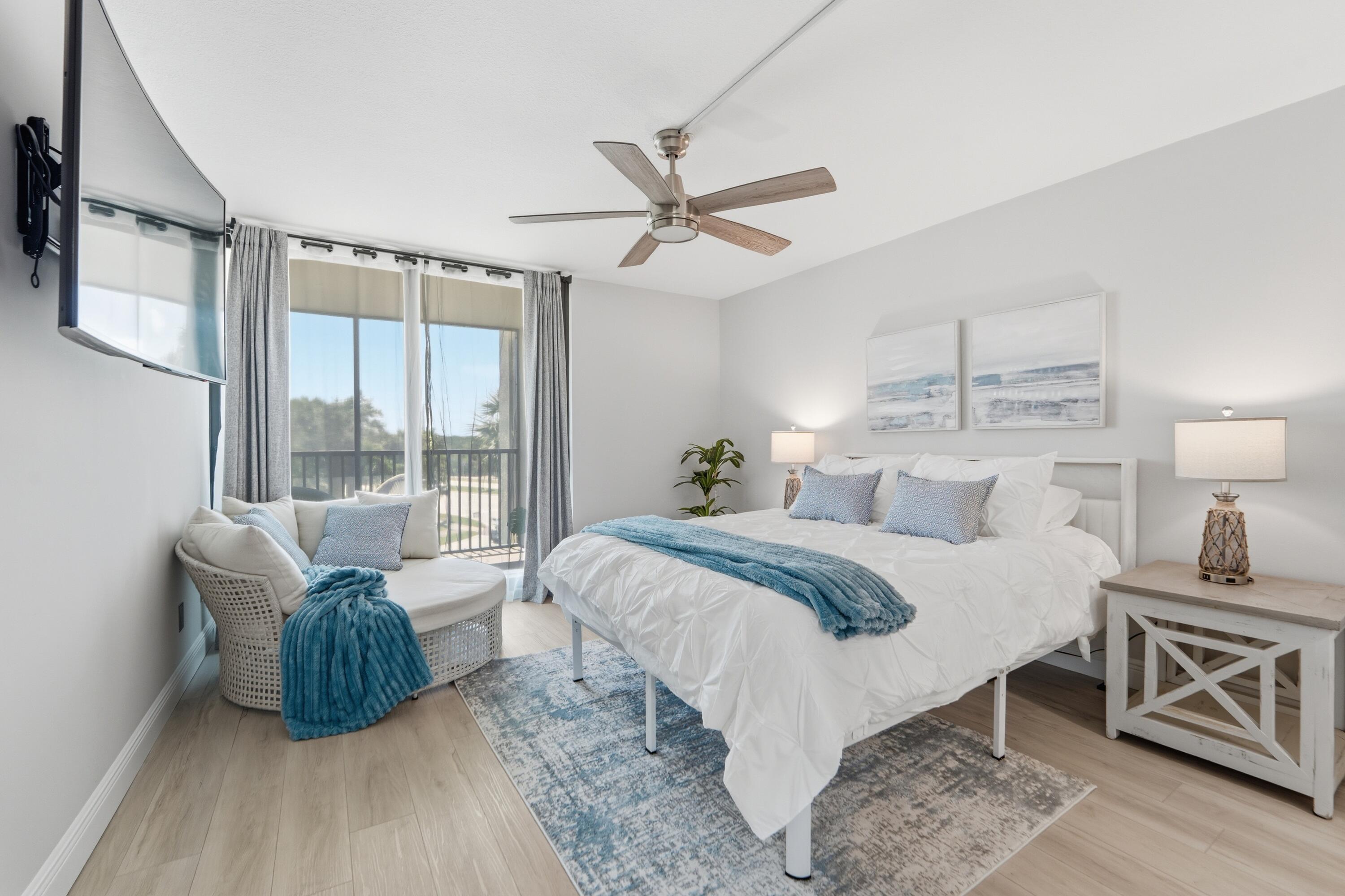 1605 Highway 1, Unit 303M1 Jupiter, FL 33477 - Photo 20 of 42 a bed room with a bed and a couch