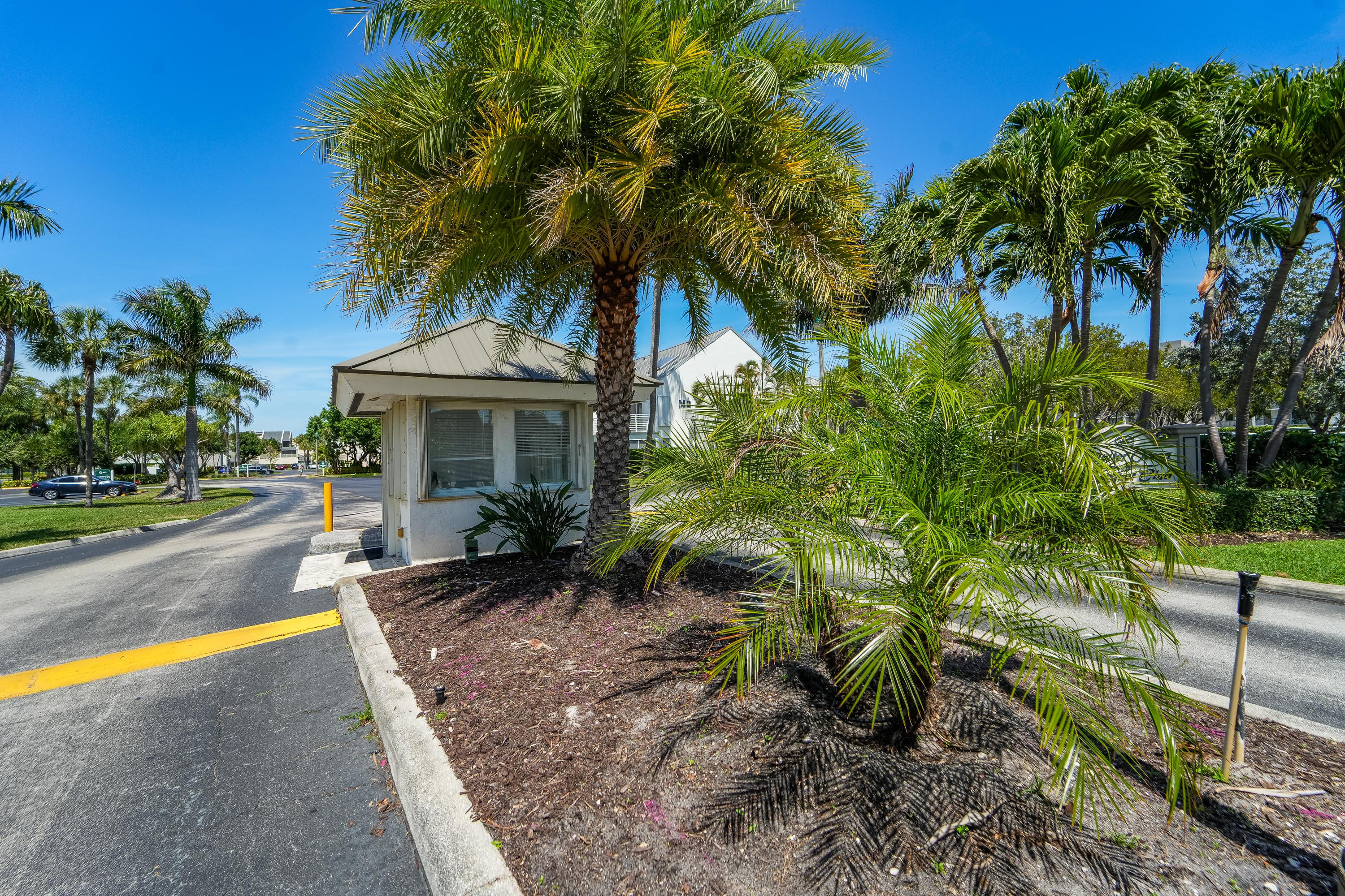 1605 Highway 1, Unit 303M1 Jupiter, FL 33477 - Photo 2 of 42 a front view of a house with a garden