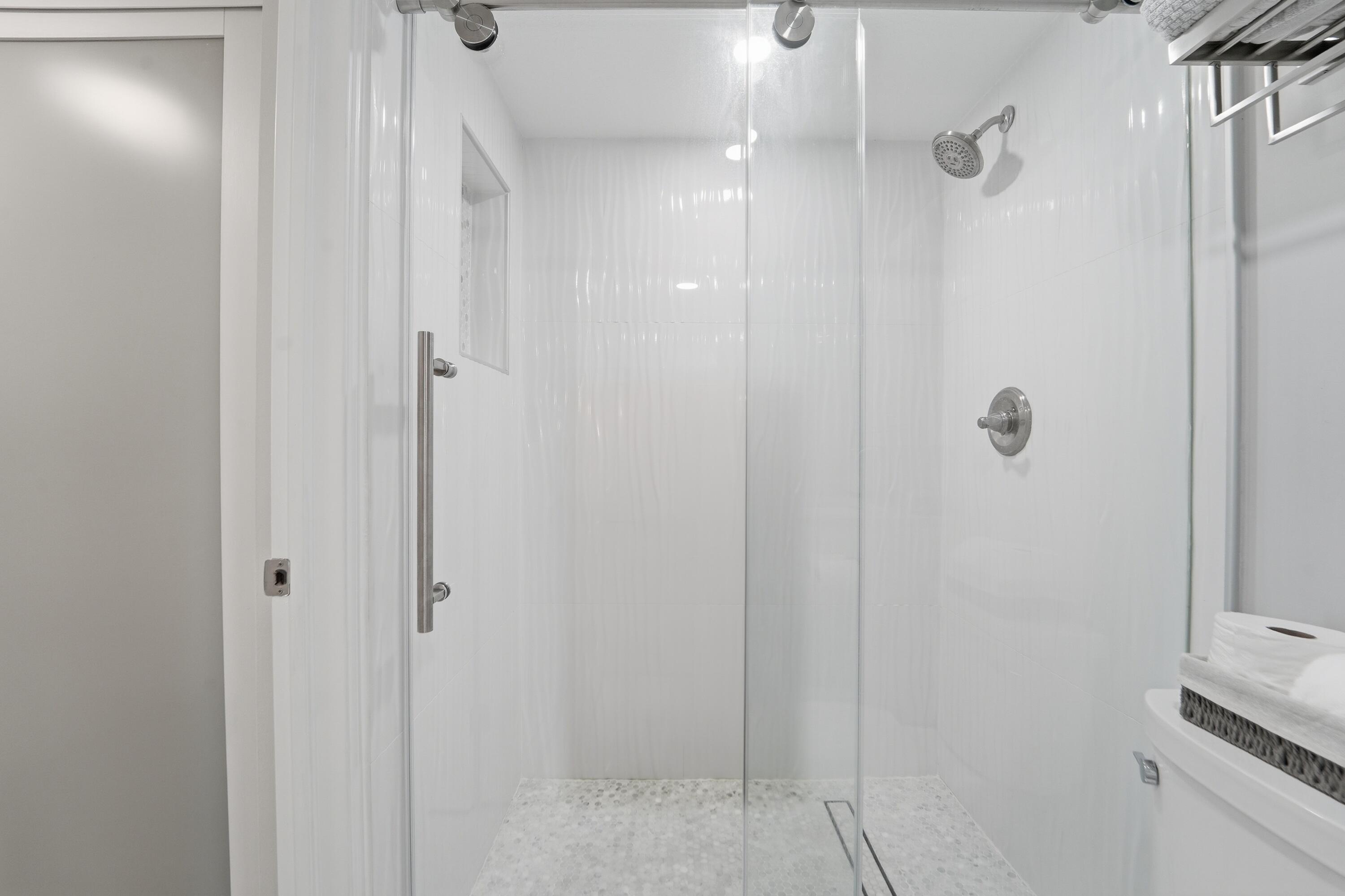 1605 Highway 1, Unit 303M1 Jupiter, FL 33477 - Photo 25 of 42 a bathroom with a shower