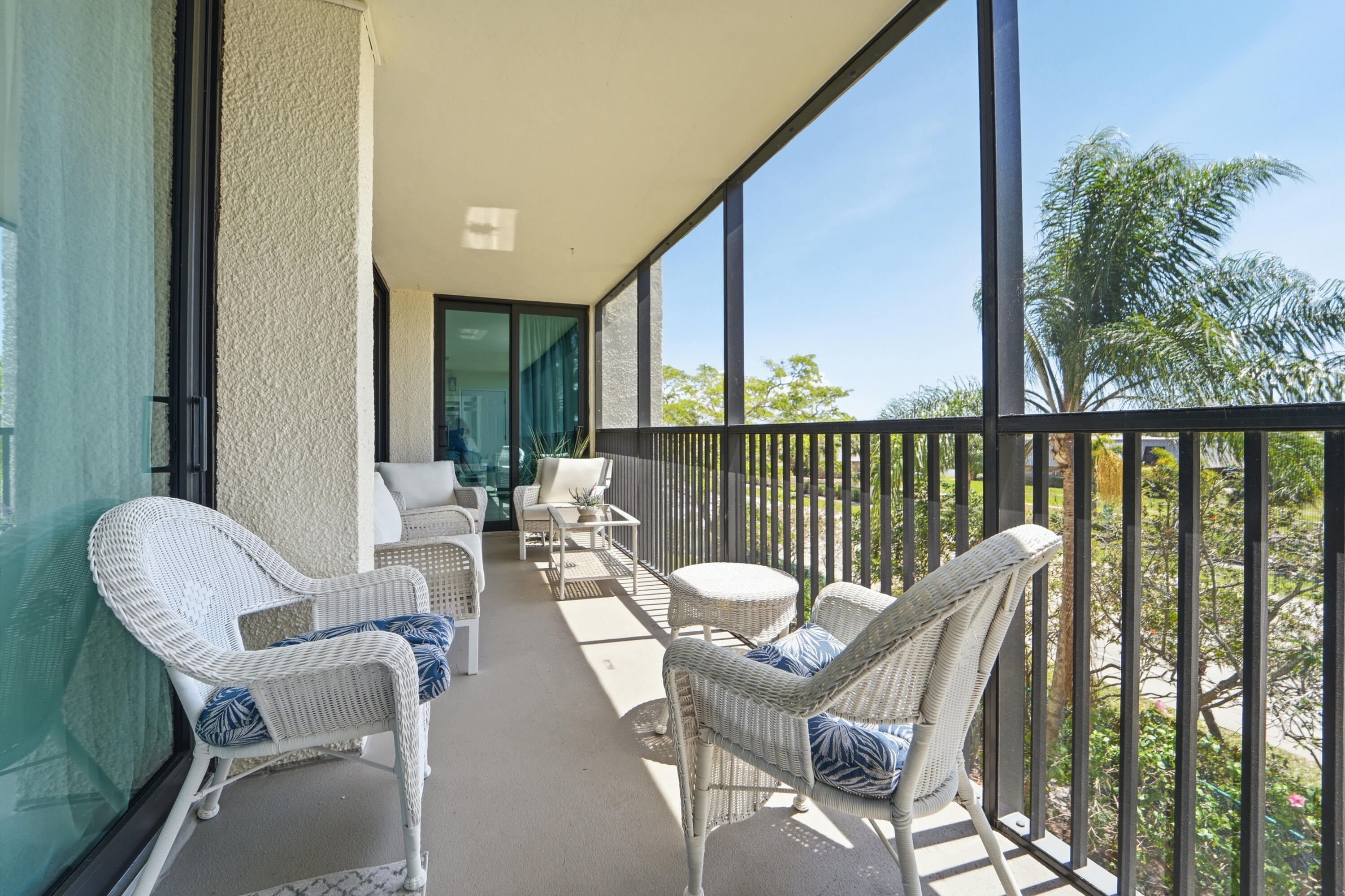1605 Highway 1, Unit 303M1 Jupiter, FL 33477 - Photo 31 of 42 a view of a chairs and table in the balcony