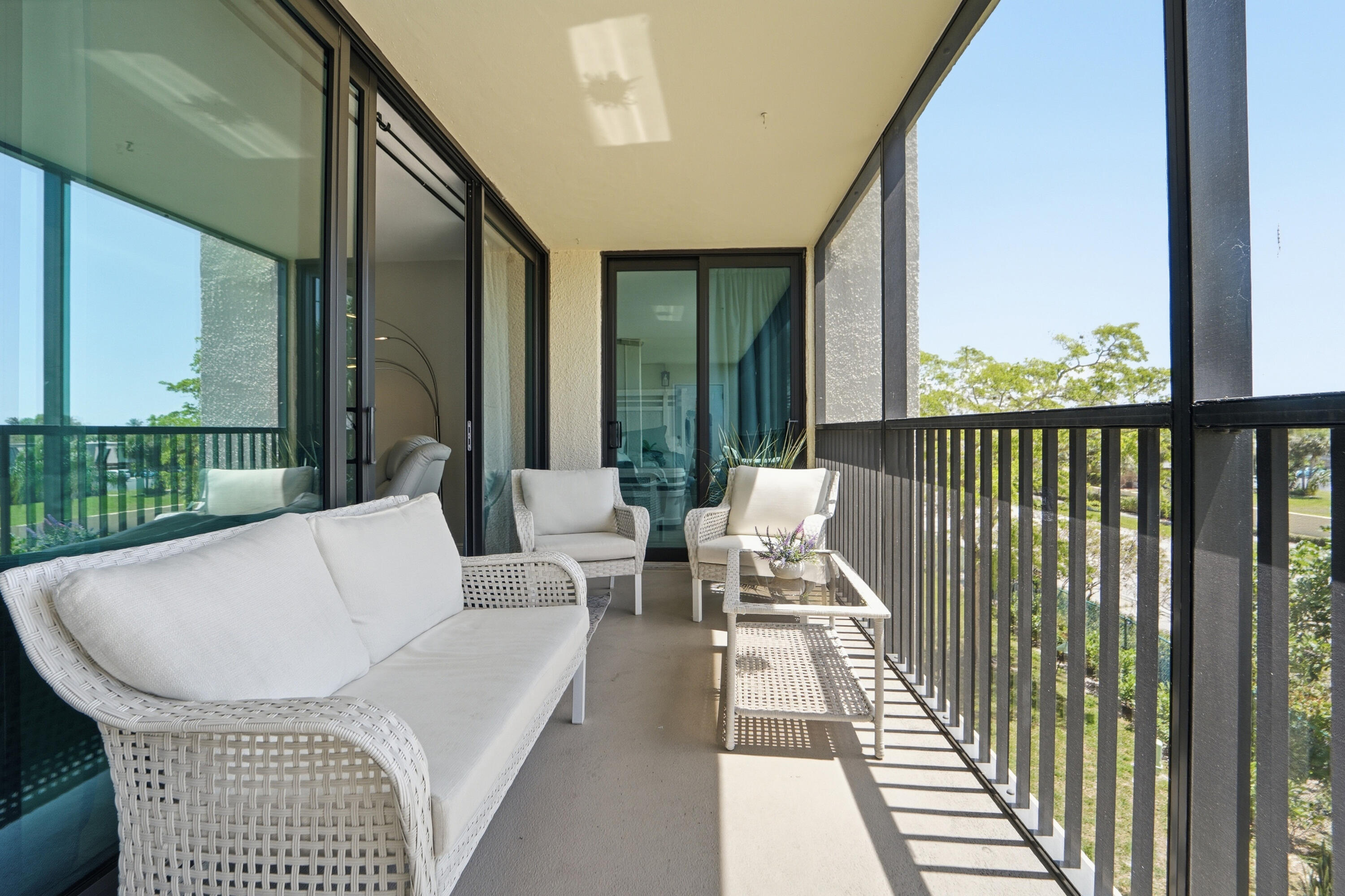 1605 Highway 1, Unit 303M1 Jupiter, FL 33477 - Photo 33 of 42 a balcony with furniture and a garden