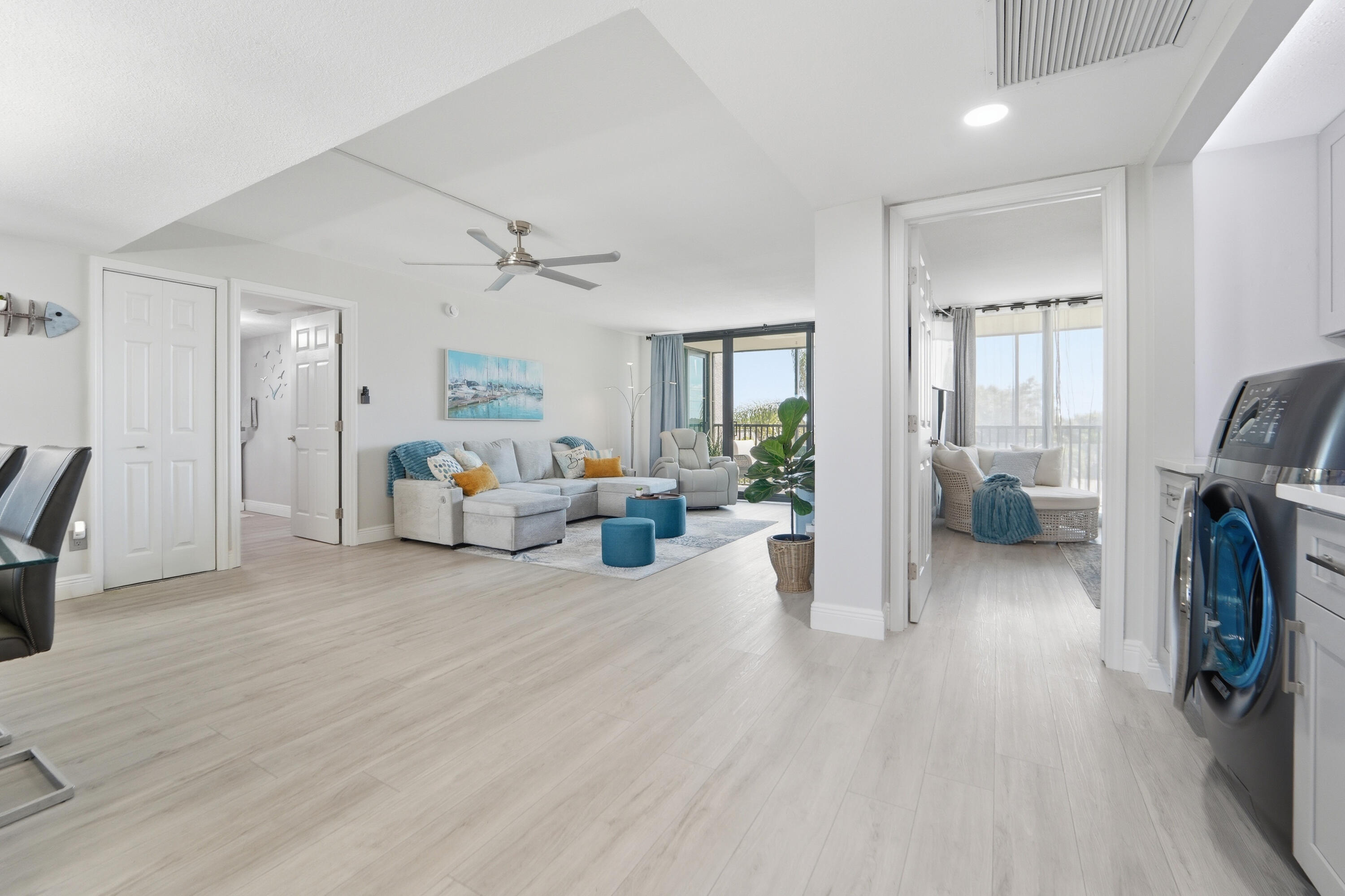 1605 Highway 1, Unit 303M1 Jupiter, FL 33477 - Photo 7 of 42 a living room with furniture and a hallway