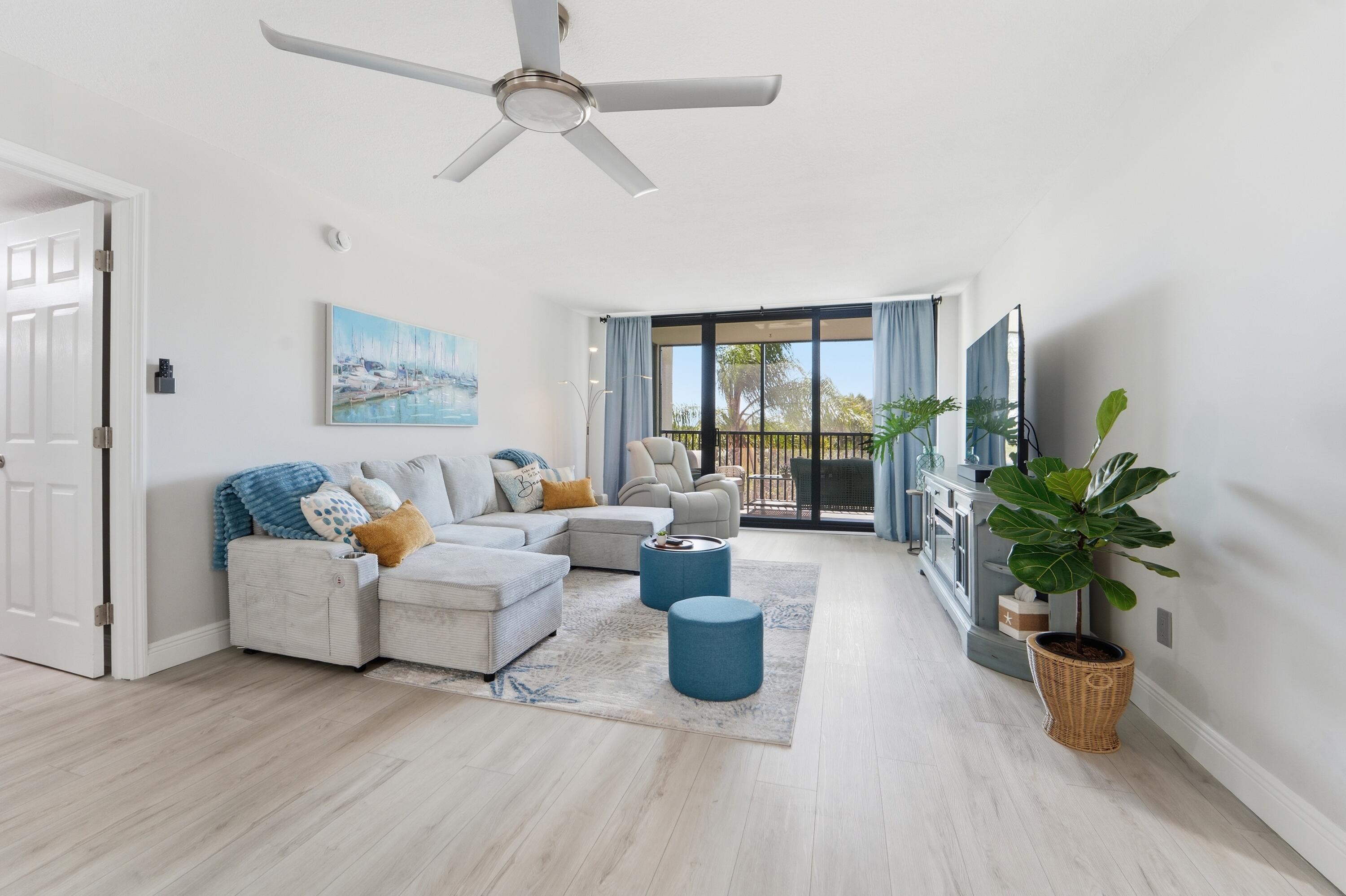 1605 Highway 1, Unit 303M1 Jupiter, FL 33477 - Photo 8 of 42 a living room with furniture potted plant and a window