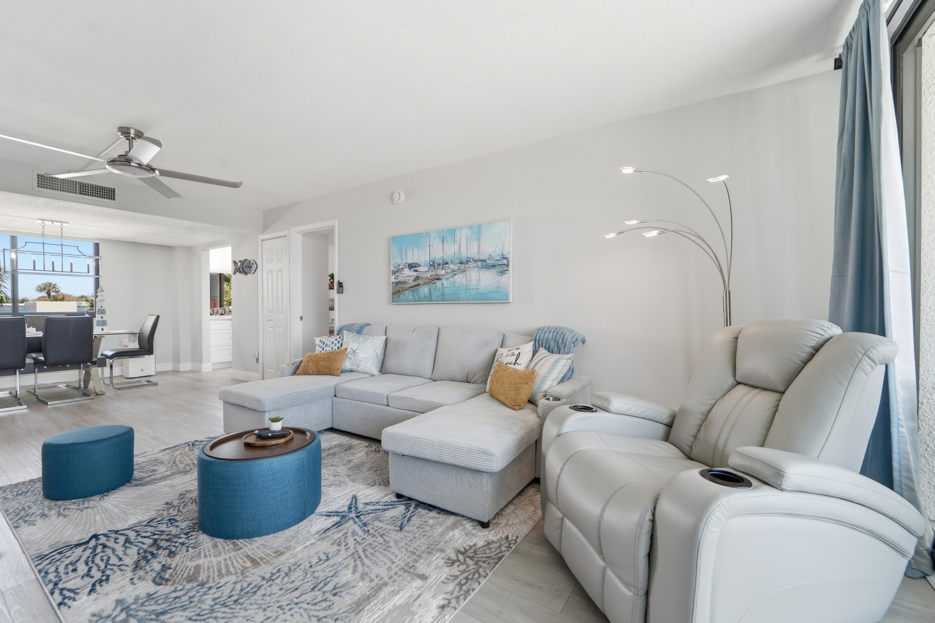1605 Highway 1, Unit 303M1 Jupiter, FL 33477 - Photo 10 of 42 a living room with furniture and a potted plant