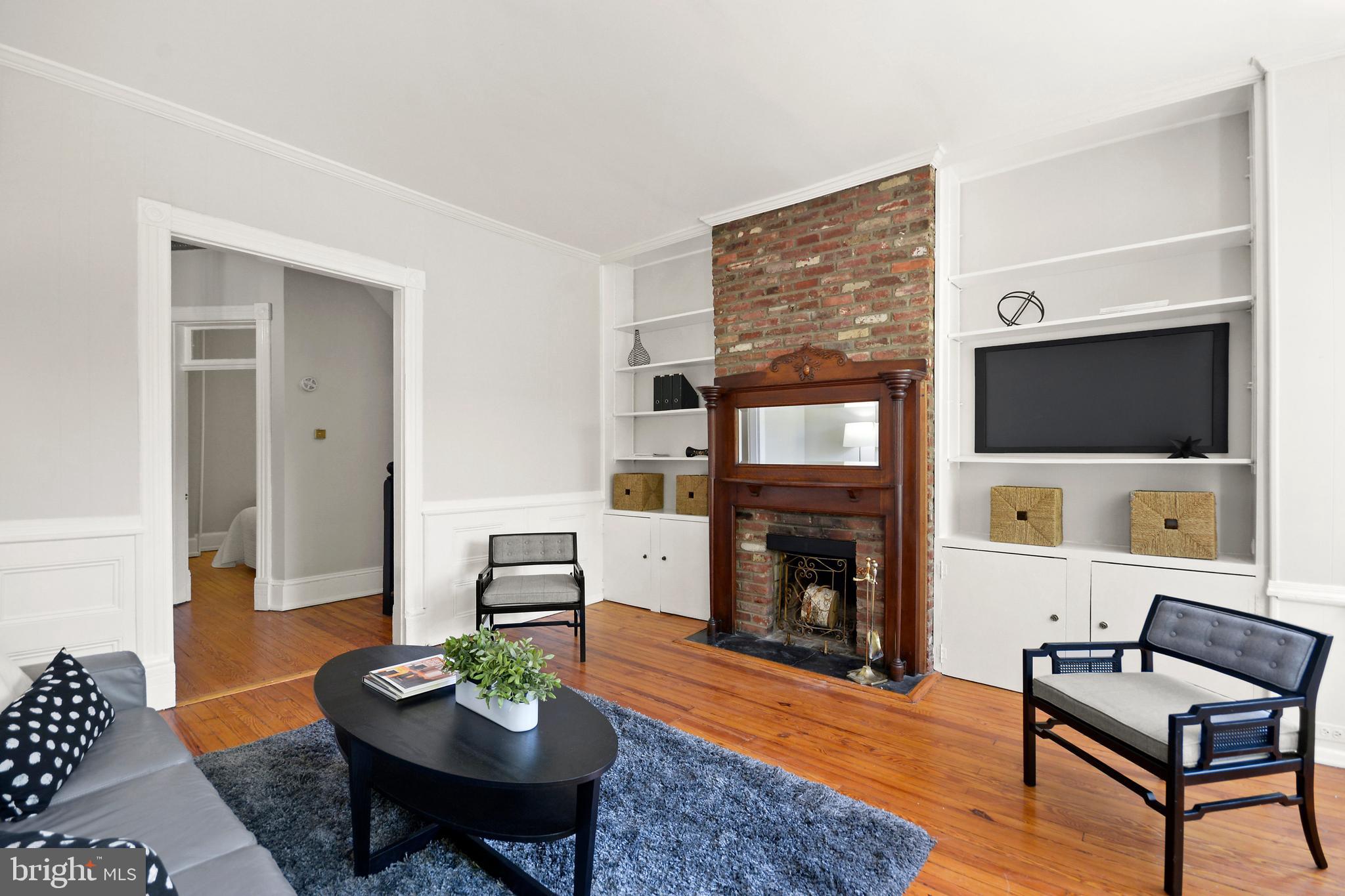 215 9th Street Northeast Washington, DC 20002 - Photo 14 of 26 This wood-burning fireplace is cozy and inviting