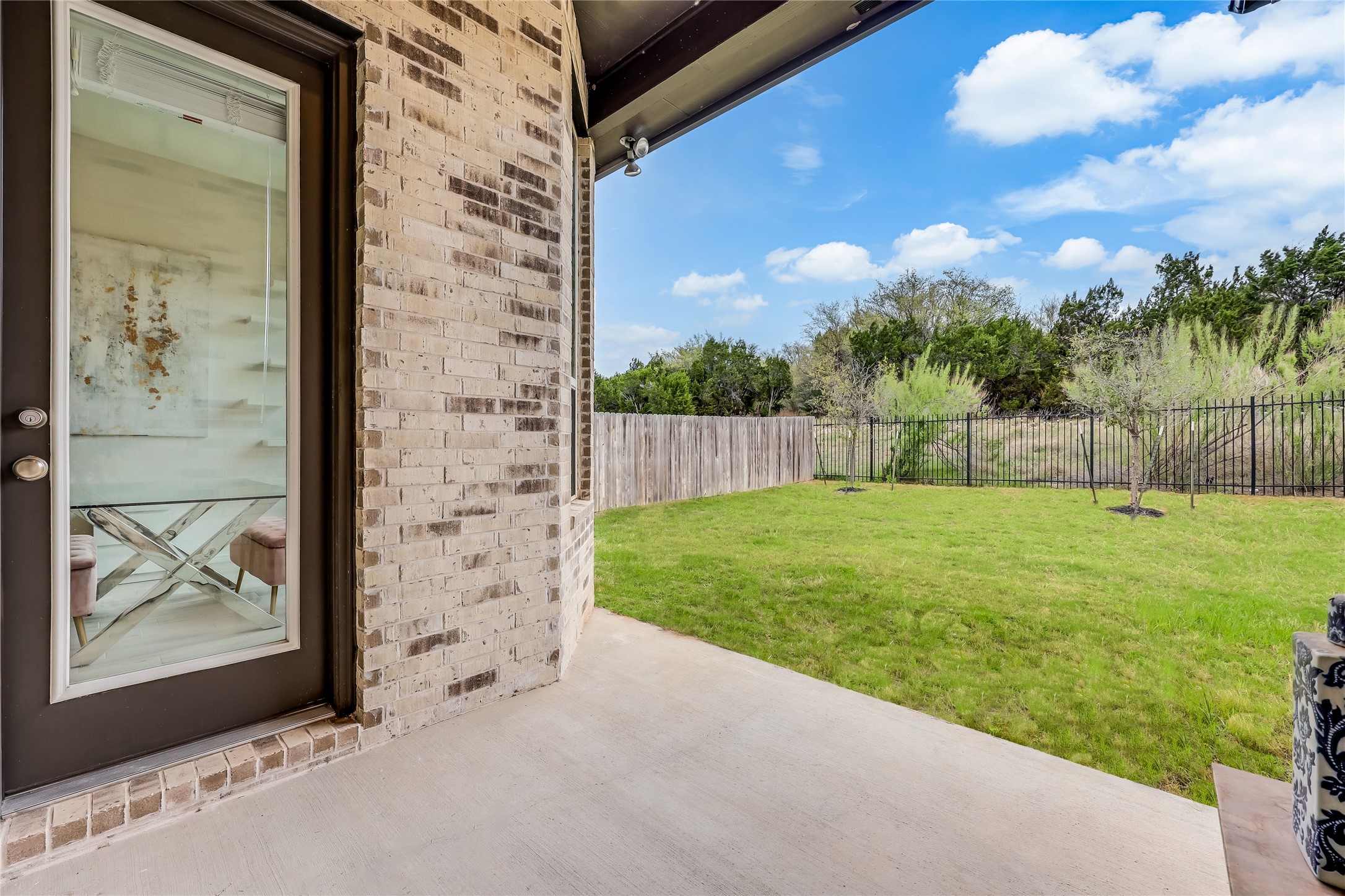 7705 Pace Ravine Drive Lago Vista, TX 78645 - Photo 25 of 40 Fenced backyard featuring a patio area
