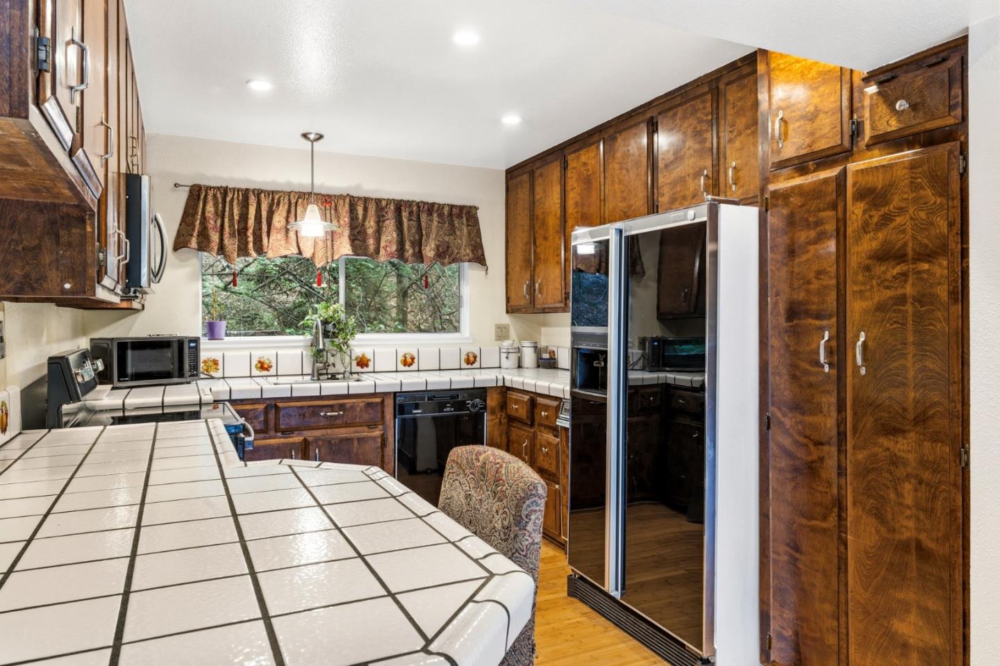 1743 Panda Way Hayward, CA 94541 - Photo 16 of 34 a kitchen with stainless steel appliances kitchen island granite countertop a refrigerator and a stove top oven