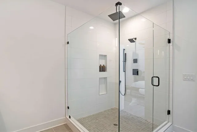 a bathroom with a shower and sink