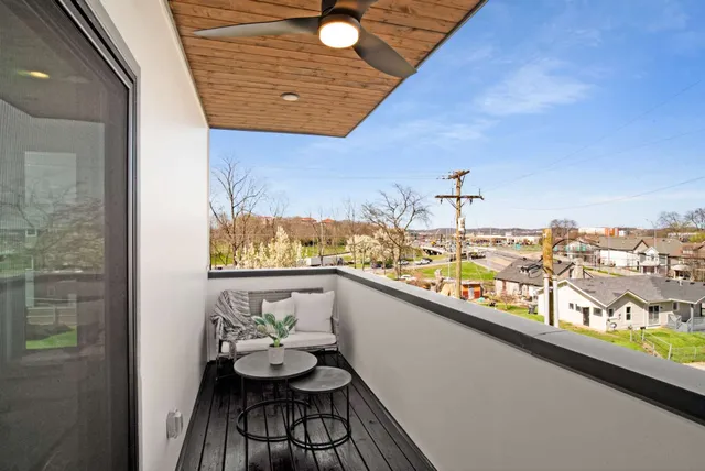a view of balcony with furniture