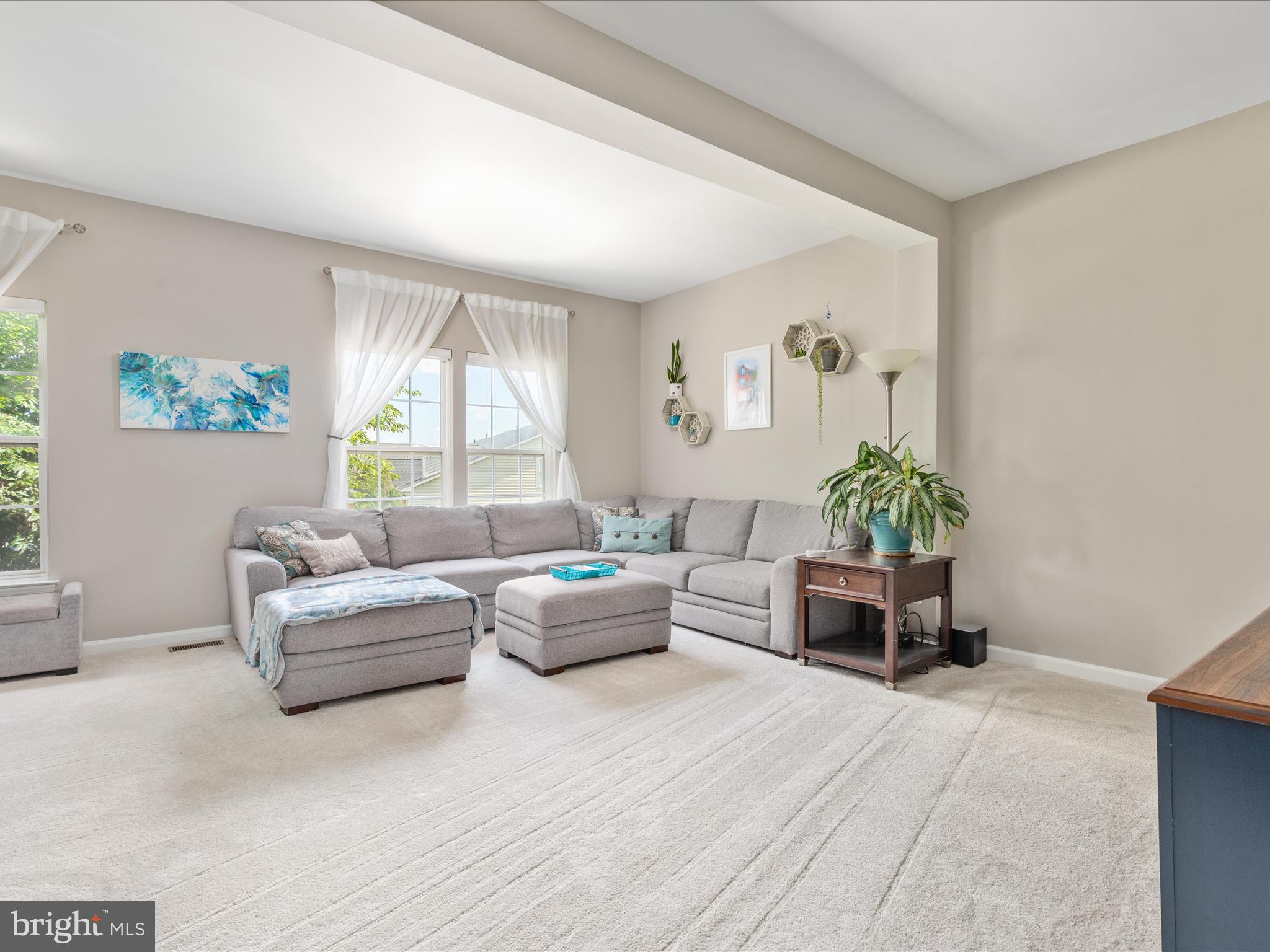 7100 Wheeling Way Gainesville, VA 20155 - Photo 17 of 39 a living room with furniture and a large window