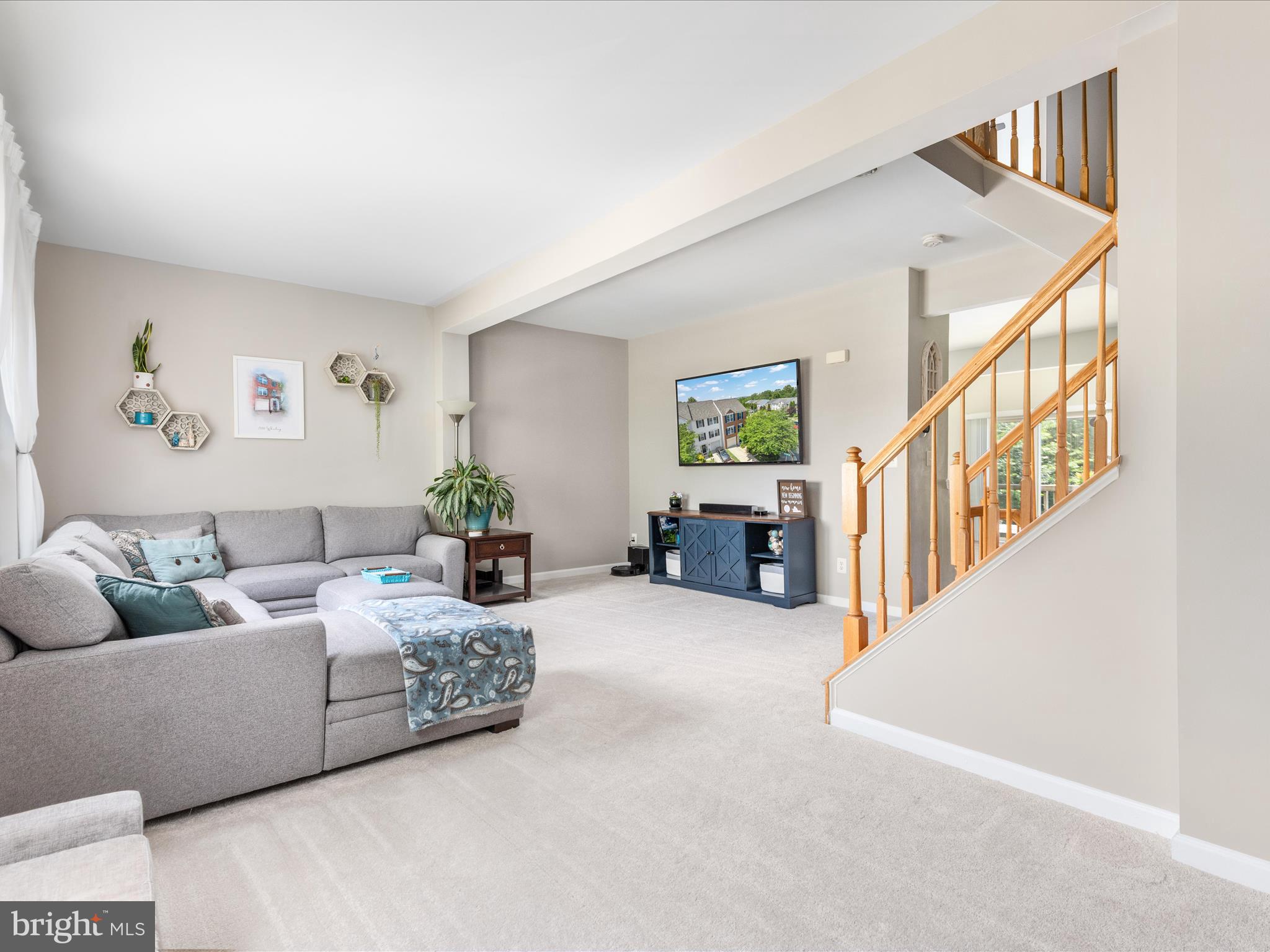 7100 Wheeling Way Gainesville, VA 20155 - Photo 18 of 39 a living room with furniture and a stairs