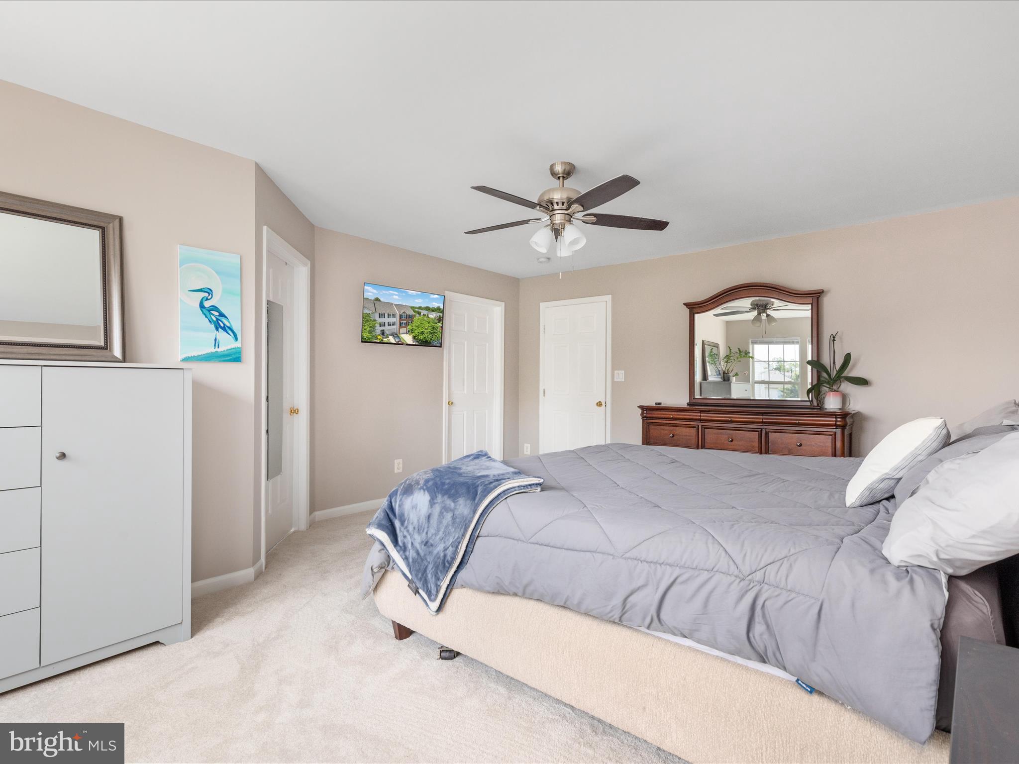 7100 Wheeling Way Gainesville, VA 20155 - Photo 23 of 39 a living room with a bed furniture and a large window