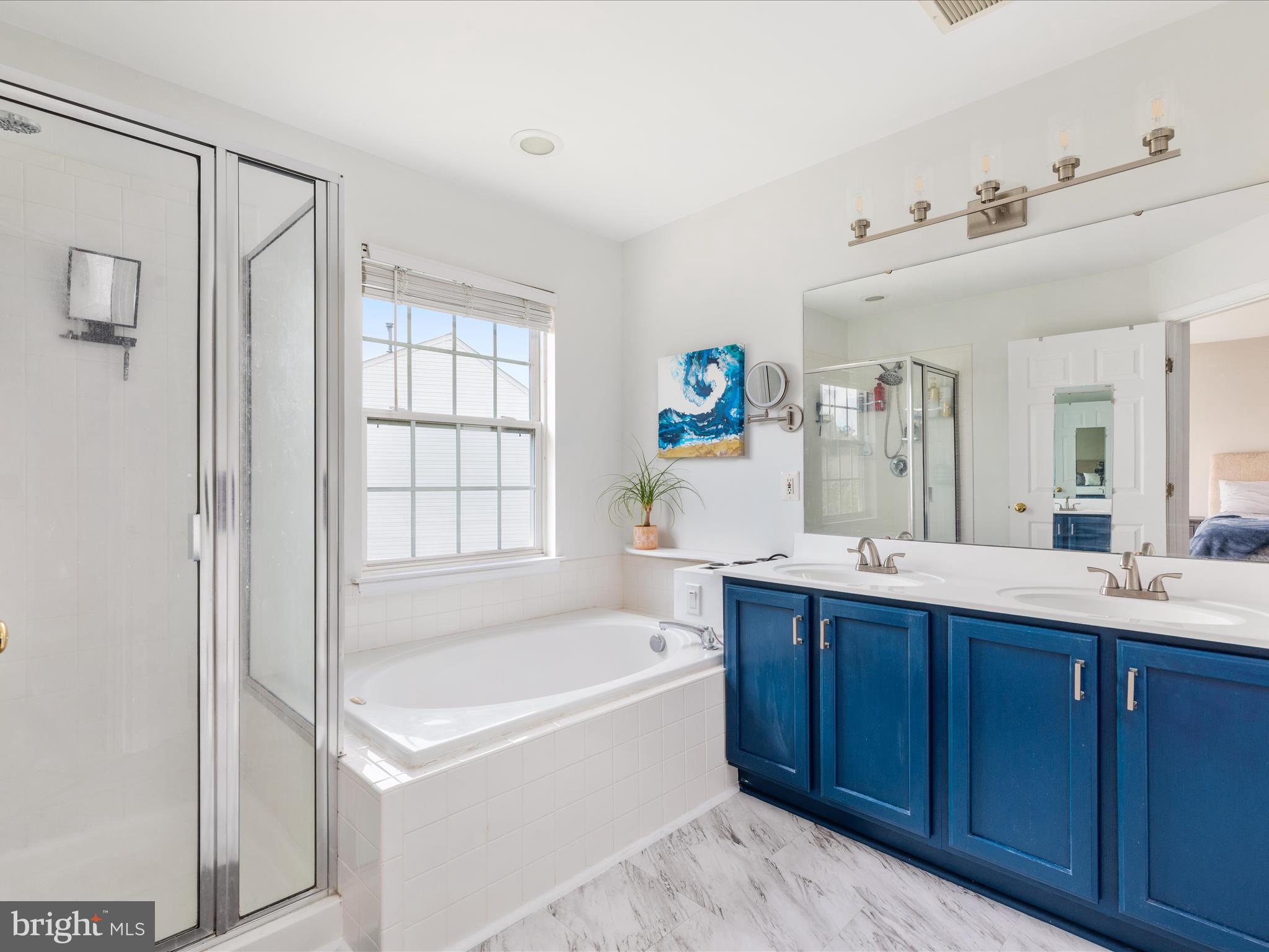7100 Wheeling Way Gainesville, VA 20155 - Photo 24 of 39 a spacious bathroom with a tub sink and mirror
