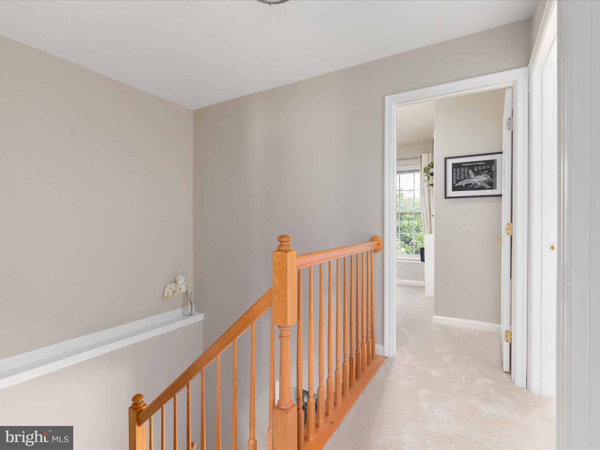 7100 Wheeling Way Gainesville, VA 20155 - Photo 26 of 39 a view of a hallway with wooden floor and entryway