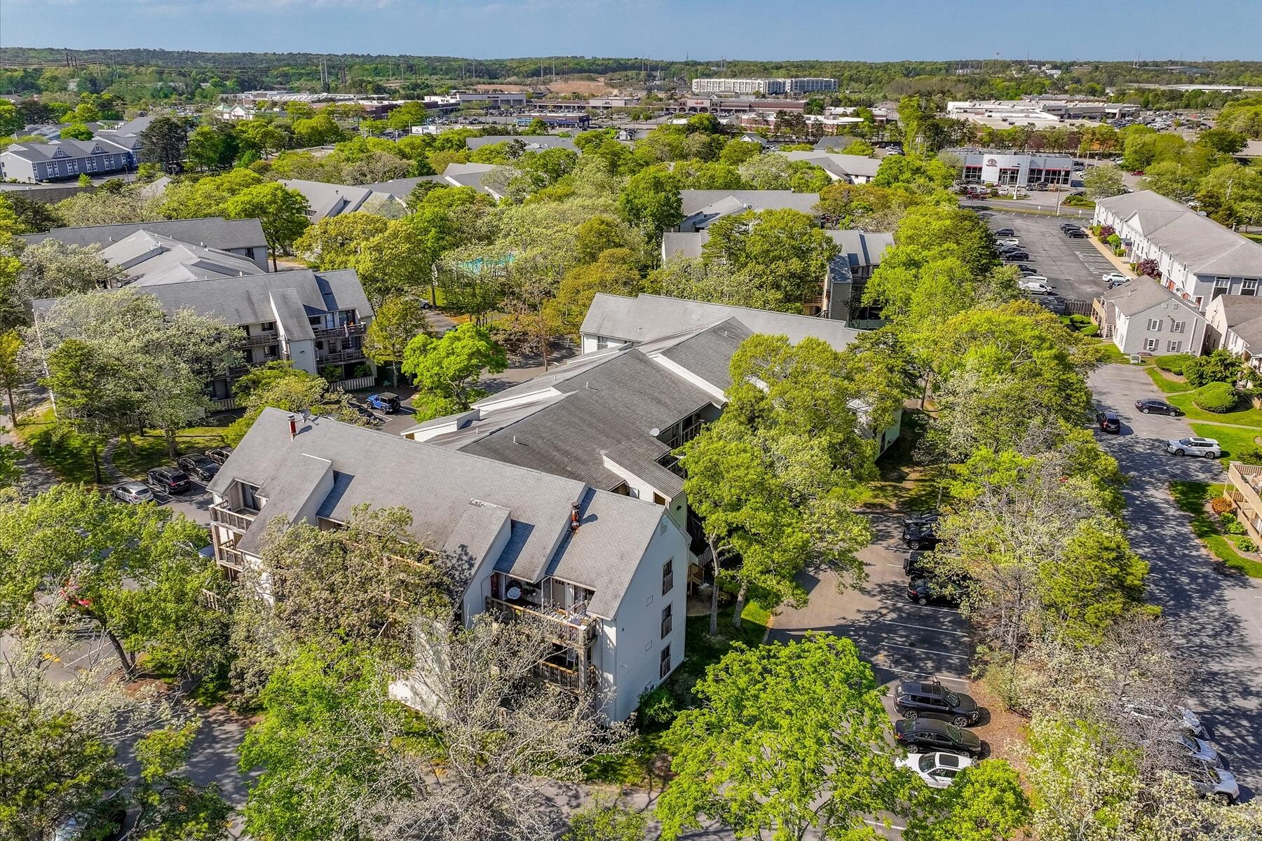 800 Bearses Way, Unit 1EB Hyannis, MA 02601 - Photo 32 of 37 an aerial view of residential houses with outdoor space