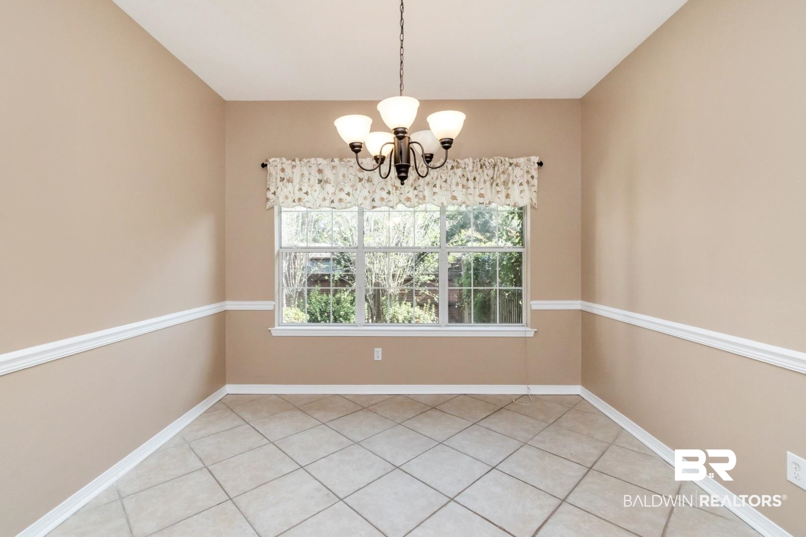 6117 Lennox Place Mobile, AL 36693 - Photo 24 of 39 Unfurnished dining area featuring baseboards and a chandelier