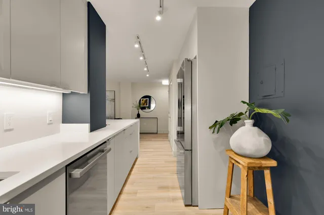 a spacious bathroom with a sink and a mirror