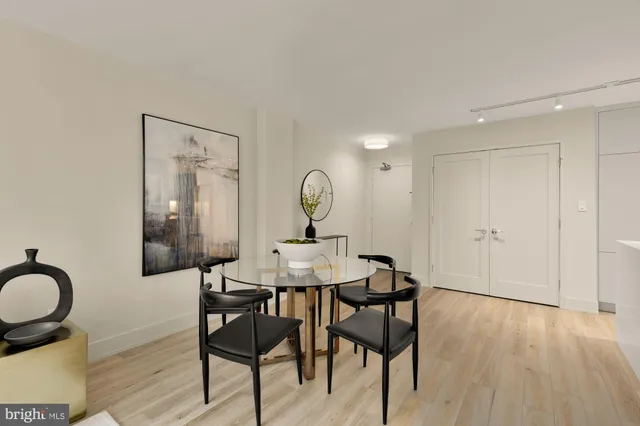a view of a dining room with furniture and wooden floor