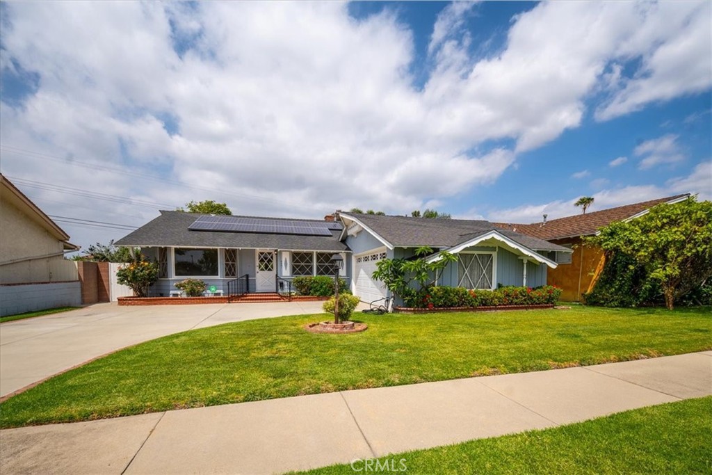 6481 Dos Rios Road Downey, CA 90240 - Photo 1 of 27 a view of house with a big yard and potted plants