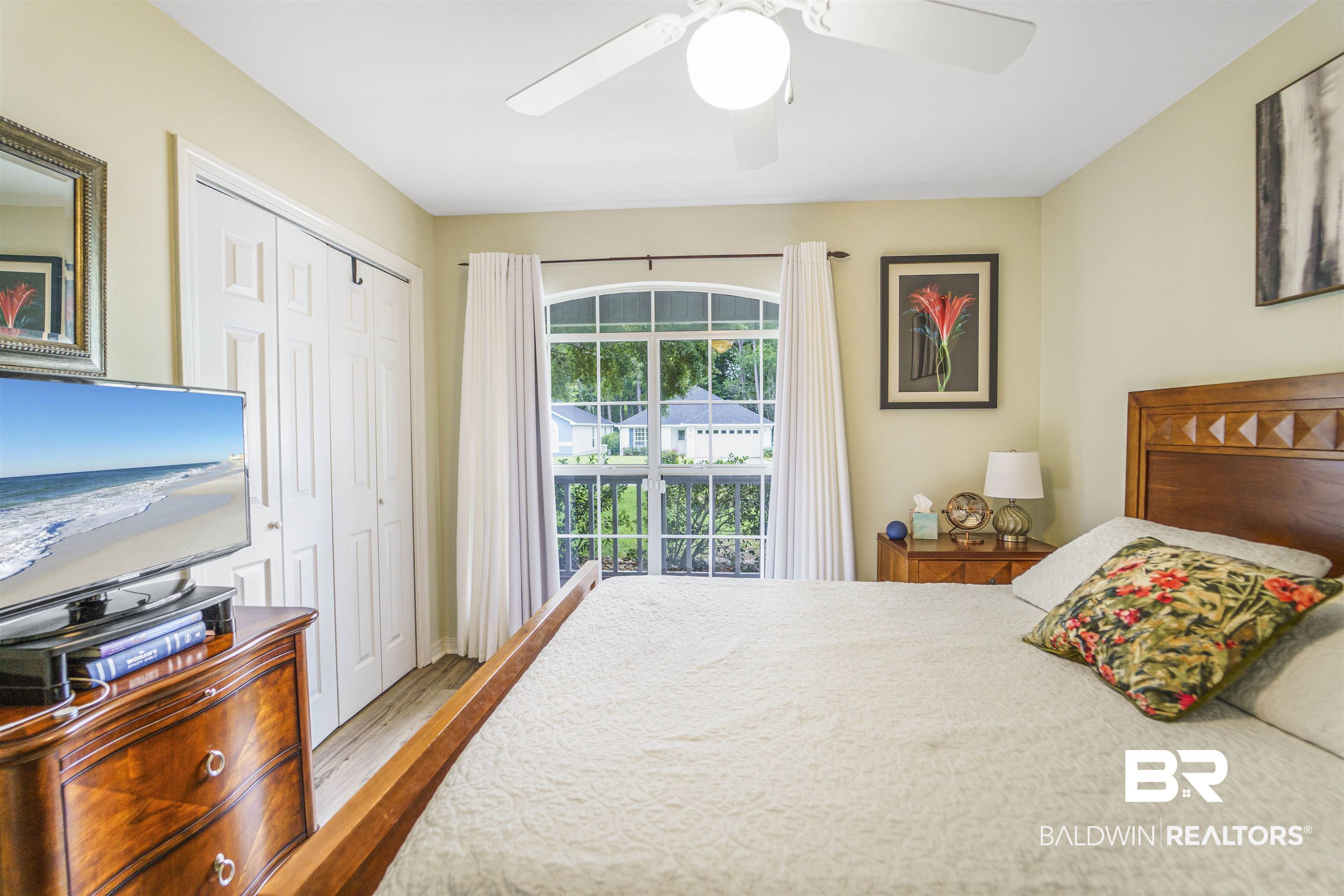 4620 Pine Boulevard Orange Beach, AL 36561 - Photo 21 of 49 Bedroom featuring wood finished floors, a closet, and ceiling fan