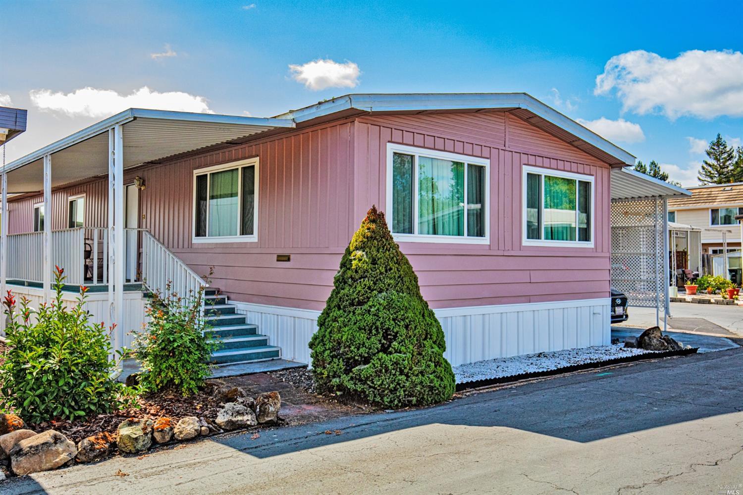 108 Cardinal Way Santa Rosa, CA 95409 - Photo 1 of 1 a backyard of a house with plants and a patio