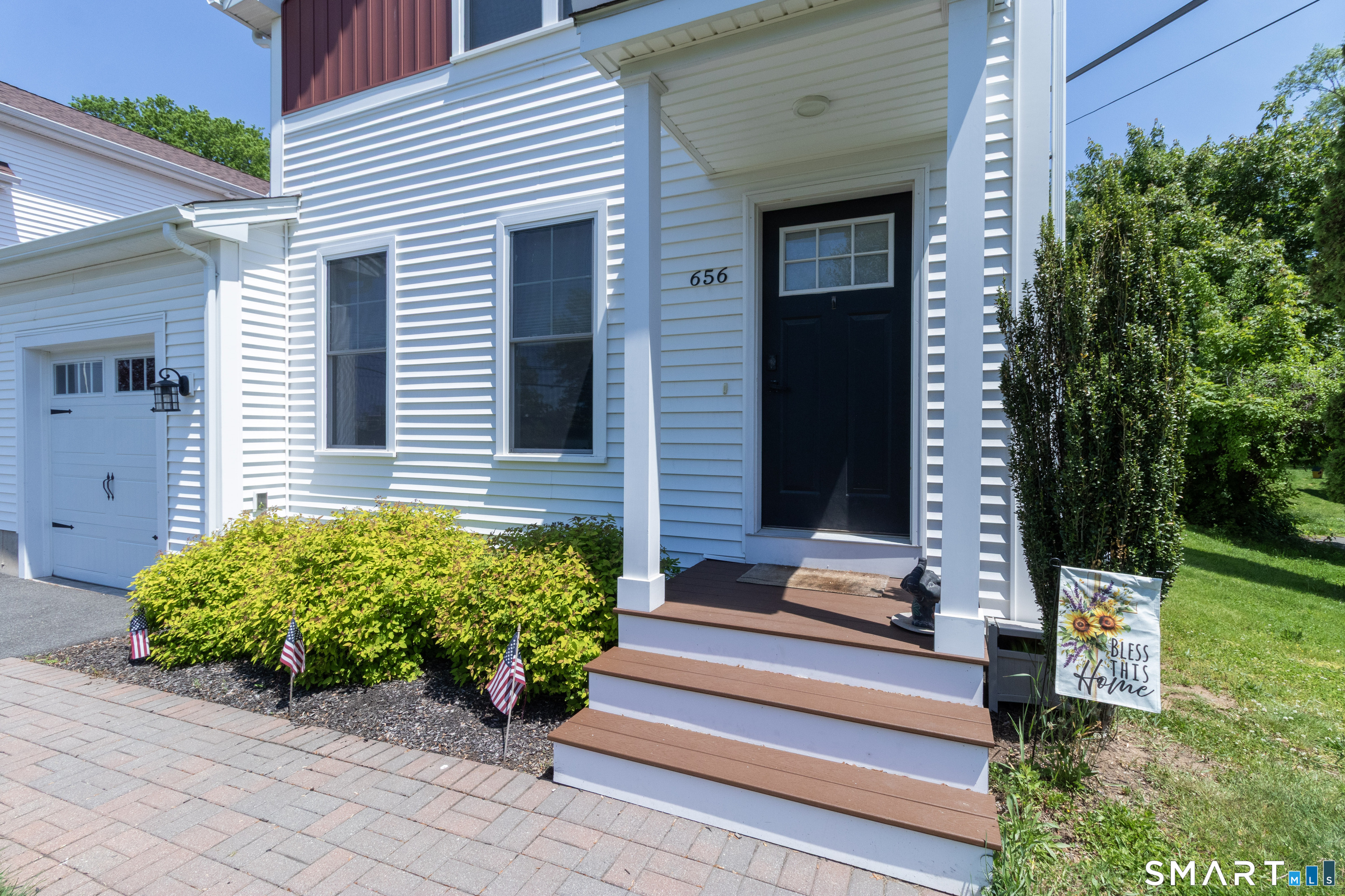 656 Bartholomew Road, Unit 656 Middletown, CT 06457 - Photo 2 of 27 a front view of a house with garden