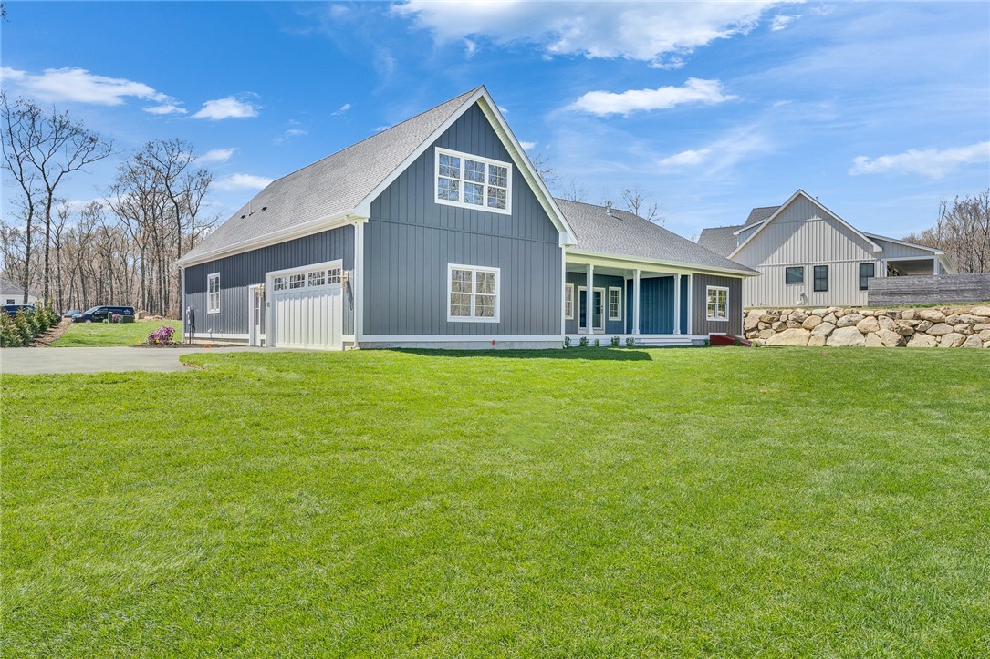 63 Forrest Lane Charlestown, RI 02813 - Photo 47 of 47 Side/rear view
with large porch/deck area.