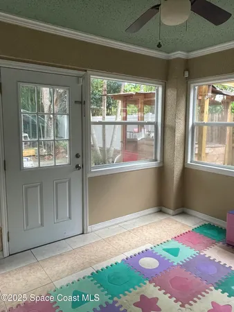 a view of an empty room with a window
