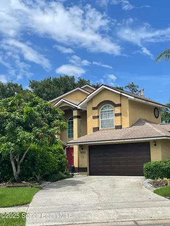 a view of front of house with a yard