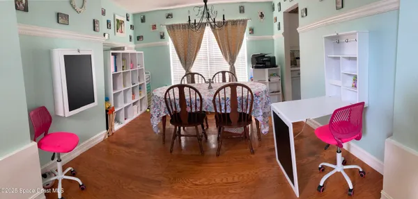 a view of a livingroom with furniture wooden floor and a rug