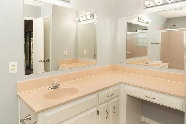 a view of a porch with furniture and floor to ceiling window