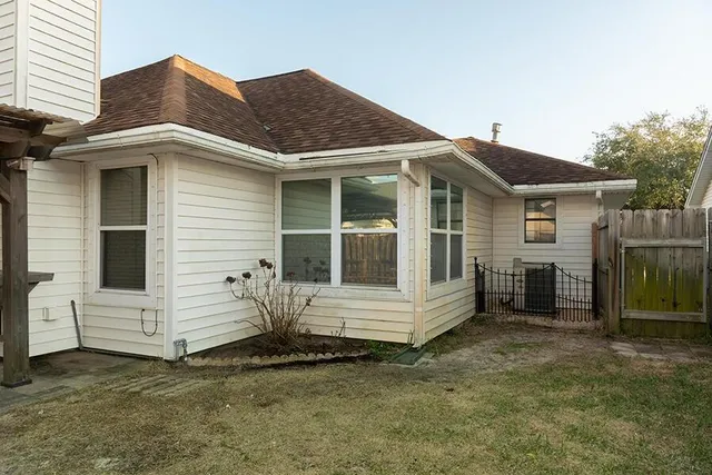 a view of a closet with wooden walls
