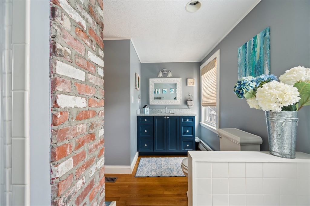 22 E Street Hull, MA 02045 - Photo 12 of 20 a living room with furniture and flowers