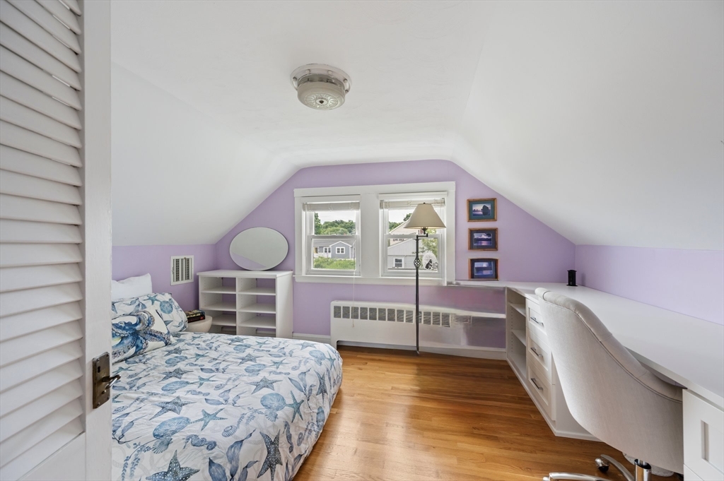 22 E Street Hull, MA 02045 - Photo 13 of 20 a bedroom with a bed and a cabinets