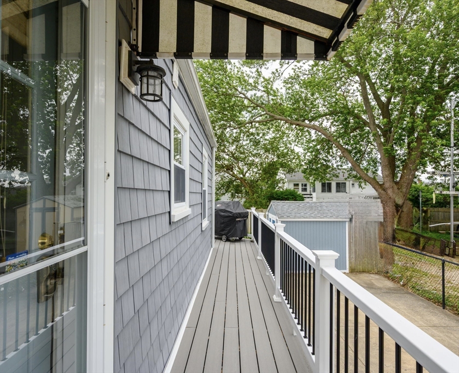 22 E Street Hull, MA 02045 - Photo 17 of 20 a view of balcony with wooden floor and fence