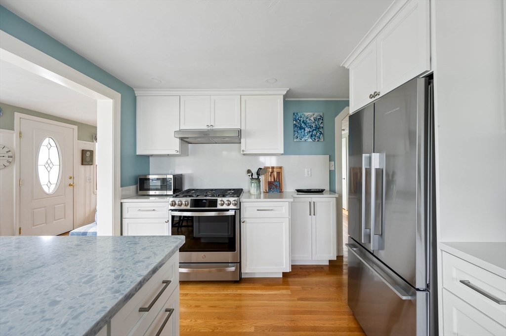 22 E Street Hull, MA 02045 - Photo 2 of 20 a kitchen with a refrigerator stove and sink