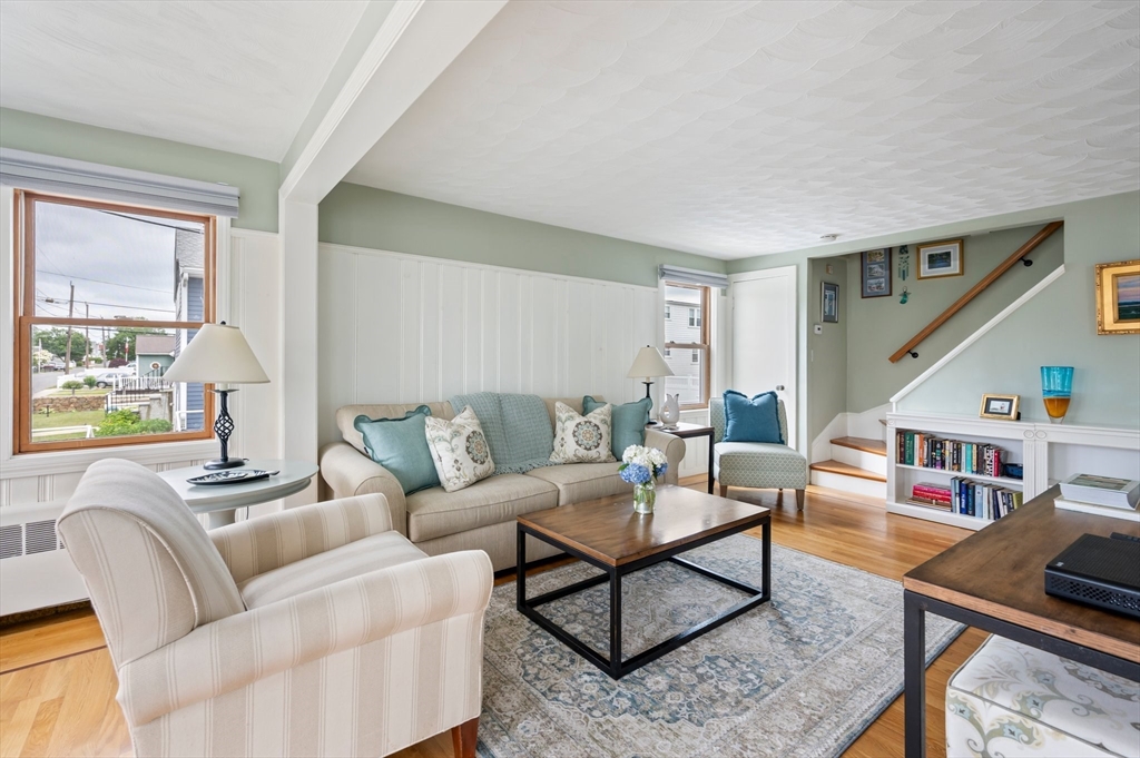 22 E Street Hull, MA 02045 - Photo 8 of 20 a living room with furniture and a book shelf
