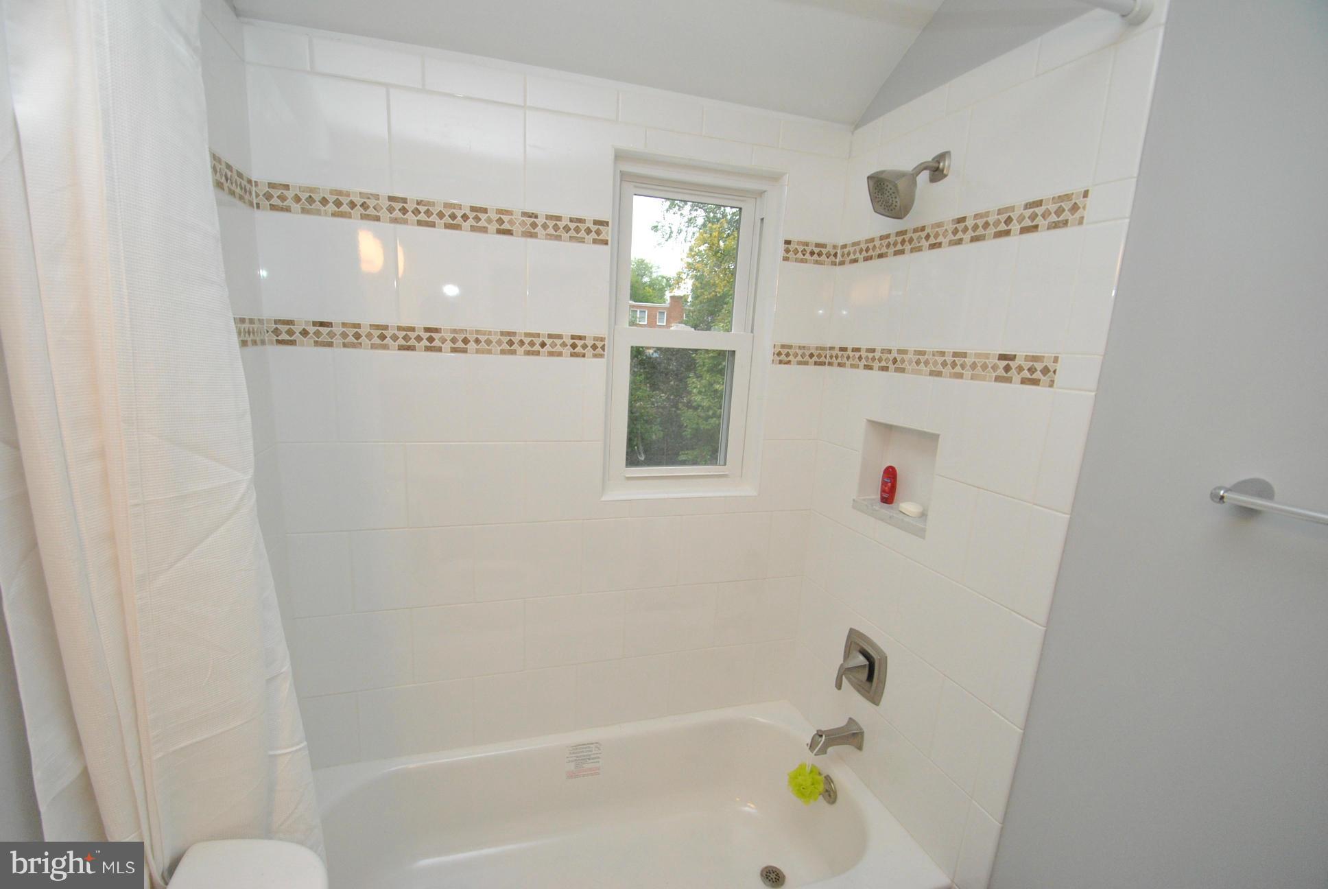 8626 Oakleigh Road Baltimore, MD 21234 - Photo 17 of 30 CUSTOM TILE & BUILT IN SOAP DISH