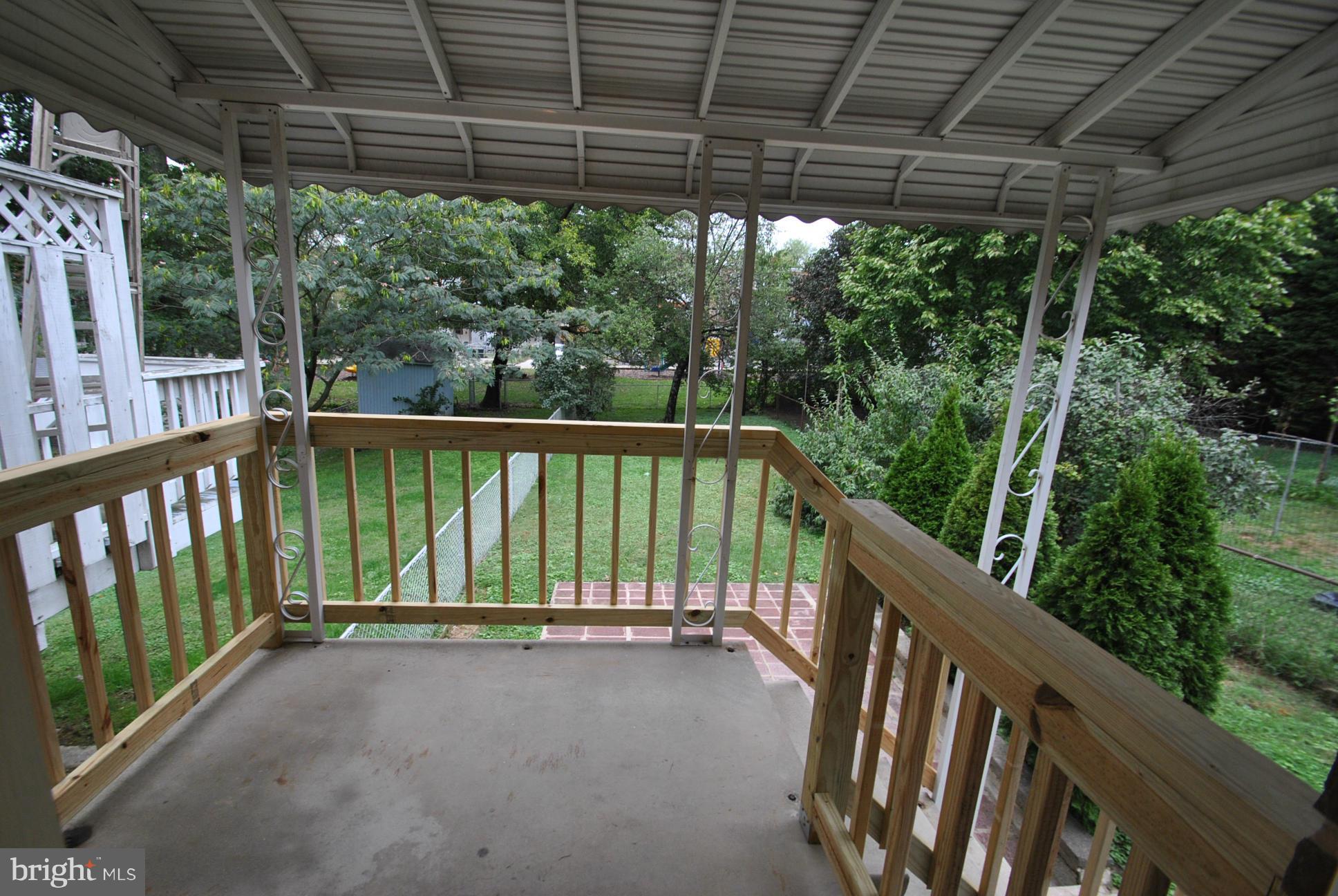 8626 Oakleigh Road Baltimore, MD 21234 - Photo 27 of 30 COVERED REAR CONCRETE DECK