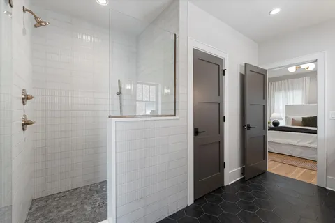 a view of a room with wooden floor closet and windows