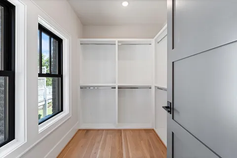 a kitchen with granite countertop a sink and cabinets