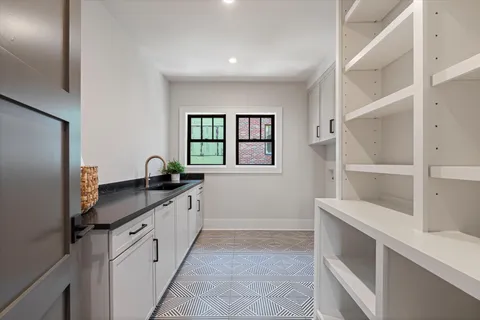 a view of a livingroom with window and furniture