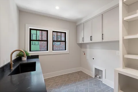 a view of a hallway view with living room and bathroom