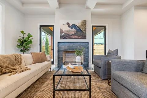 a large kitchen with stainless steel appliances granite countertop a sink and wooden cabinets